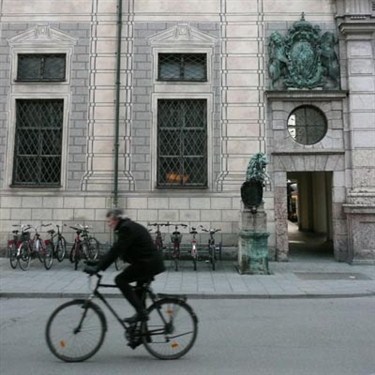 Bicyclist in front of the Residenz in Munich